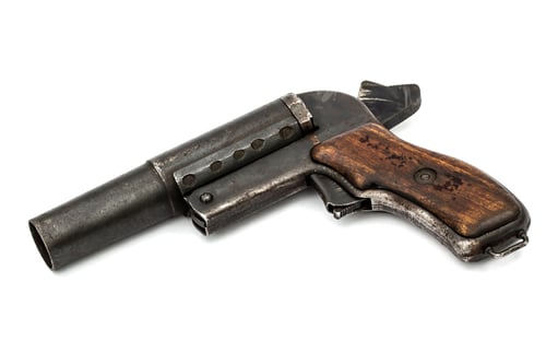 Preview: Old signal pistol, flare gun with the hammer cocked, isolated on white