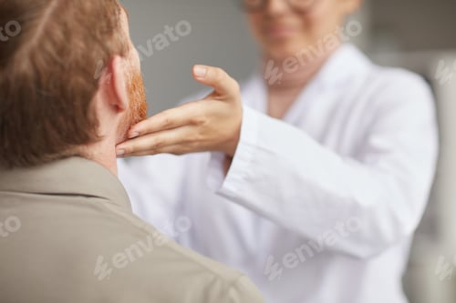Preview: Examining the throat of patient