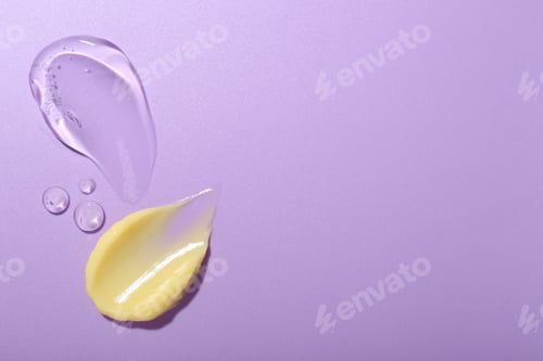 Preview: Cream and gel samples on violet background, flat lay. Space for text