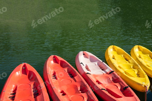 Preview: Colorful canoe anchored at pier in lake