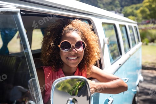 Preview: Woman looking out of camper van window