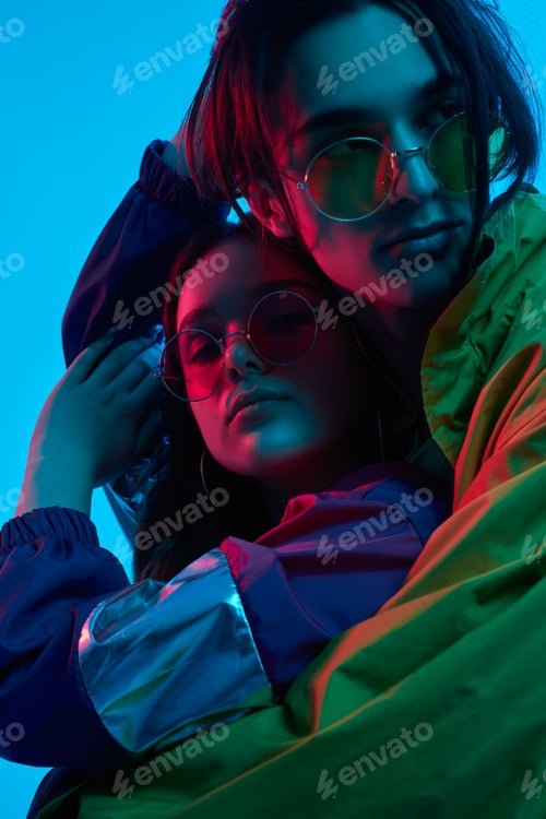 Preview: Trendy teenagers under colorful neon illumination