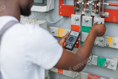Preview: Close up of man using multimeter for work on solar station