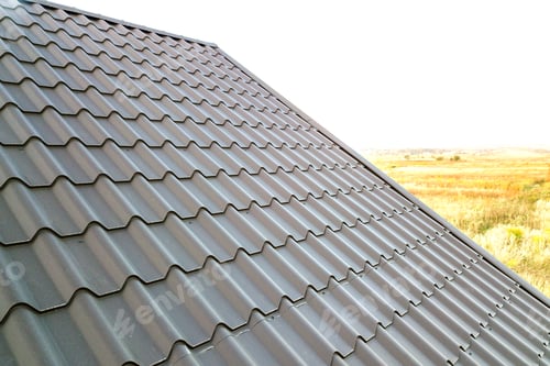 Preview: Close up of new house roof structure covered with metal tile sheets