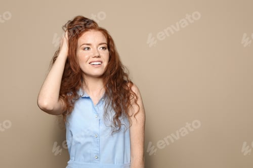 Preview: Woman with Freckles and Red Hair Posing Indoors