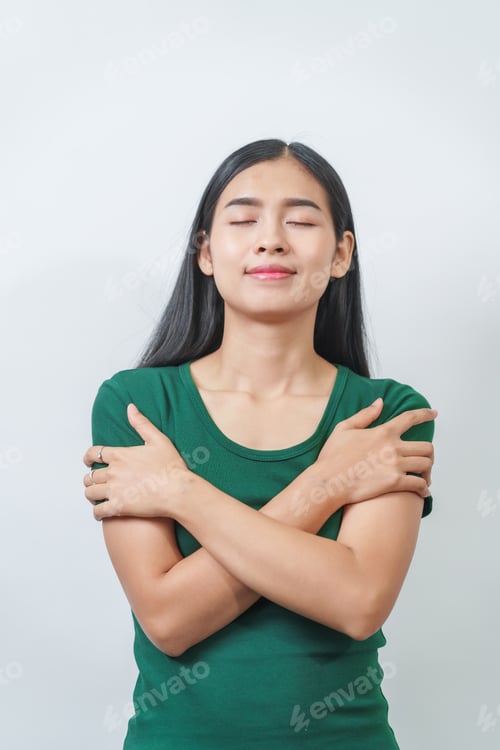 Preview: Happy and calm Asian girl is seen enjoying a pleasant aroma, taking deep breaths of fresh