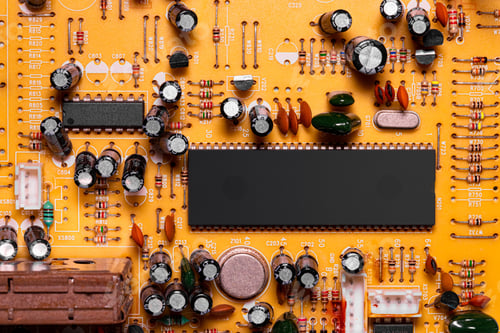 Preview: Close up of components and microchips on old PC circuit board.