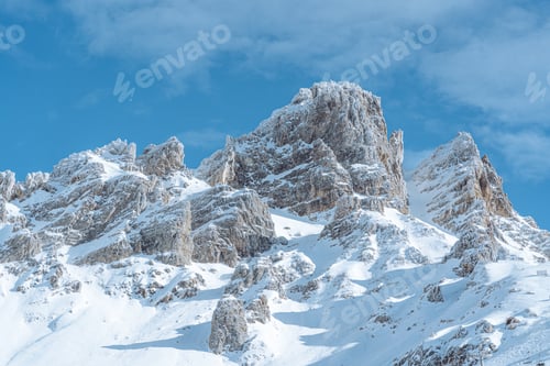 Preview: Closeup of snowy mountains in the sun