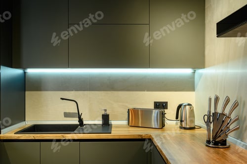 Preview: Modern large luxury dark gray kitchen closeup