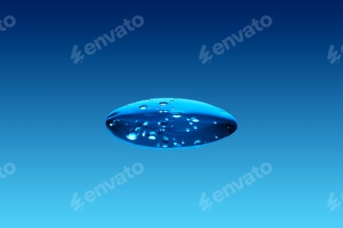 Preview: A drop of cosmetic product or serum on a blue background.