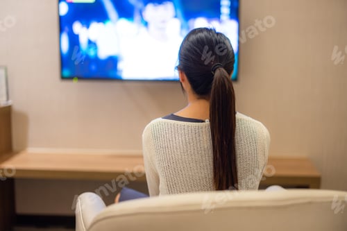 Preview: Woman watch TV at home