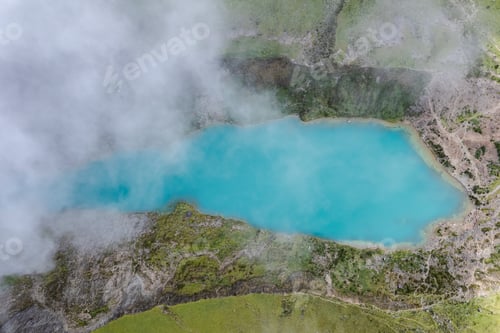 Preview: A drone shot looking through the clouds at Humantay Lagoon in Peru