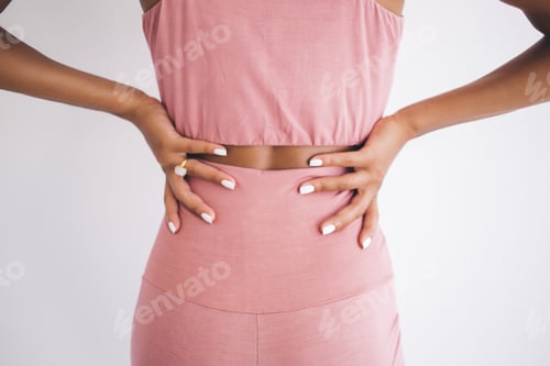 Preview: Unrecognizable female with good body shape keeping healthy sportive lifestyle