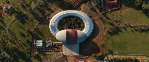 Preview: Aerial top view of Pantanal Biopark surrounded by greenery at golden hour in Campo Grande, Brazil