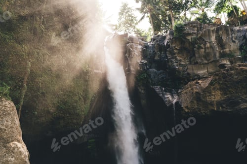 Preview: Waterfall in rocky ravine on sunny day