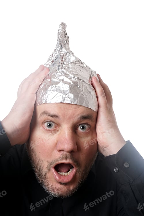Preview: paranoid man wearing tin foil hat