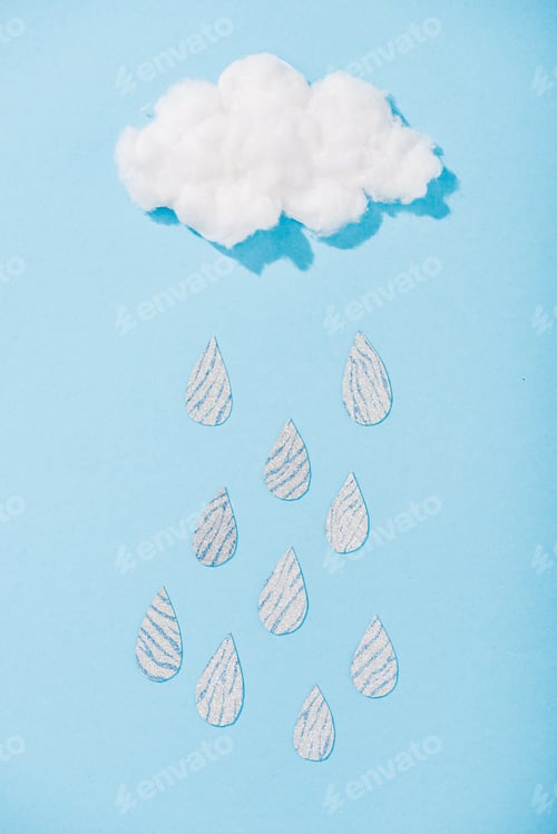 Preview: top view of cotton candy cloud with glitter raindrops on blue