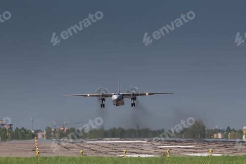 Preview: turboprop old aircraft taking off with smoke, fly low over the military runway.