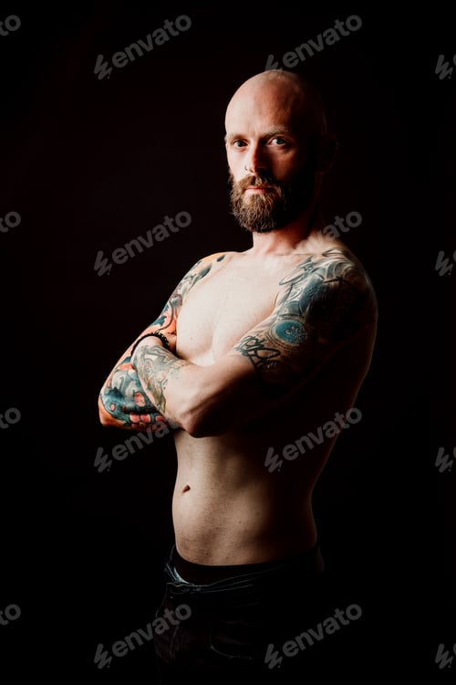 Preview: Young shirtless bearded guy with tattoos