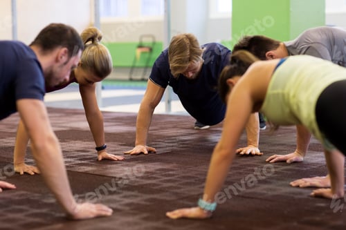 Preview: group of people exercising in gym