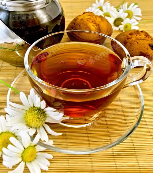 Preview: Herbal tea with daisies and kettle