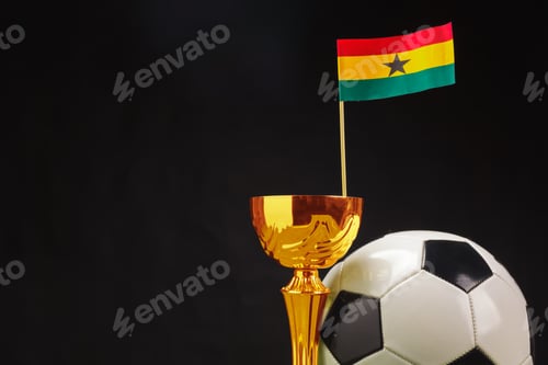 Preview: Ghana football trophy with flag and soccer ball on dark background showcasing team spirit