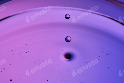 Preview: The texture of a serum or cosmetic oil with drops.