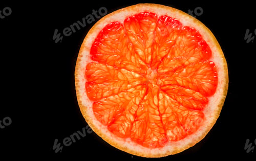 Preview: cut grapefruit, black background