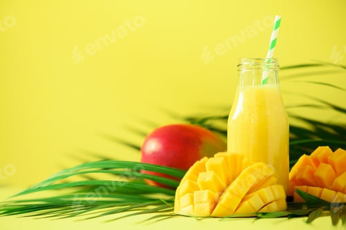 Preview: Mango Juice and Fresh Fruit on Yellow Background
