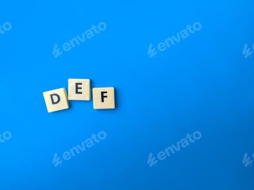 Preview: Toys word with word DEF on blue background. Education concept