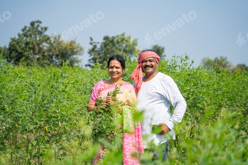 Preview: Happy Indian couple at their farm.
