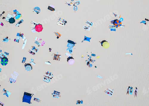 Preview: Overhead view of sunbathing on a beach in summer. Colourful umbrellas and beach towels