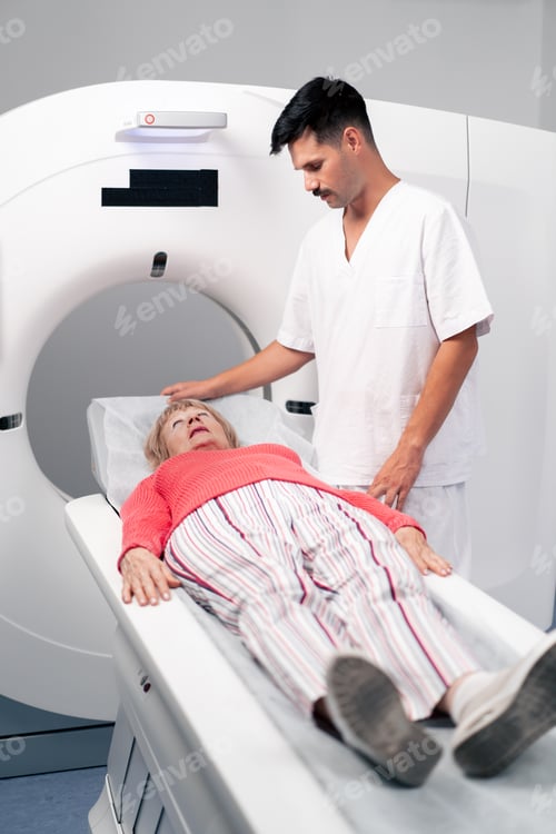 Preview: in a modern clinic in a white office, a drug for MRI examination of the brain of an elderly woman