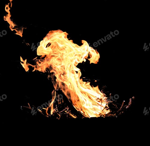 Preview: Burning firewood with a strong and high flame on a black background
