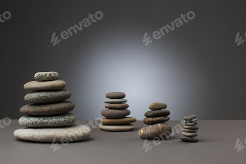 Preview: Stones Standing In Balance On Grey Background