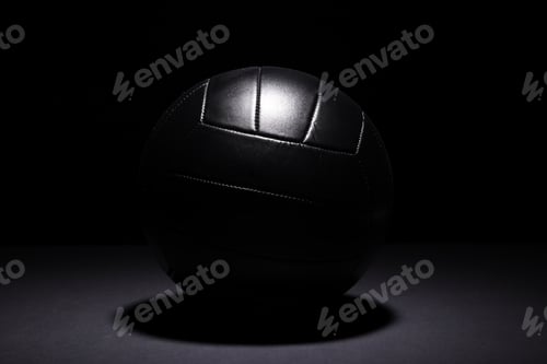 Preview: Dark volleyball on a dark background, with space for your text.