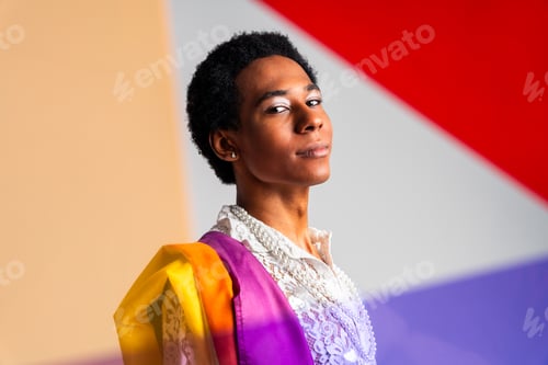 Preview: Fashionable fluid gender man posing in studio