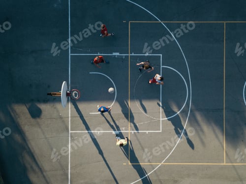 Preview: Overhead view of friends on basketball court playing basketball game