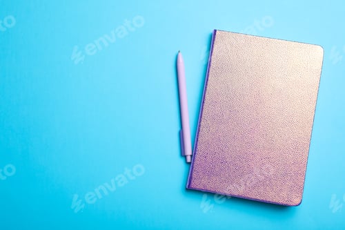 Preview: Stylish glitter notebook and pen on light blue background, flat lay. Space for text