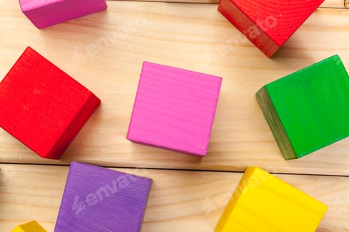 Preview: colorful wooden cubes on wooden table