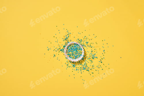 Preview: Easter cake baking dish with candy and scattered confectionery topping dressing on yellow background
