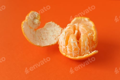 Preview: Peeling orange with orange copy space.