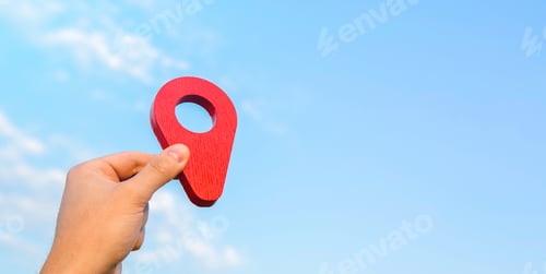 Preview: Holding a red location pin pointer in the sky.
