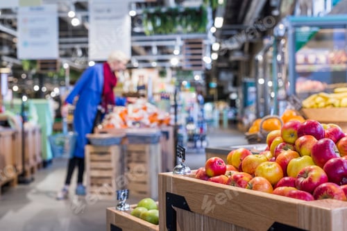 Preview: A shopper browsing produce at a vibrant grocery store.