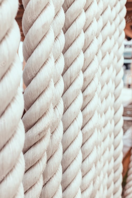 Preview: Strong white ropes weigh upright on white background