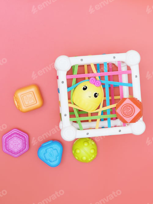 Preview: top view of kids educational toy, colorful cube with details for skills developing