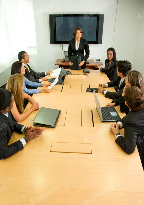 Preview: Businesspeople In A Business Meeting In An Office Smiling
