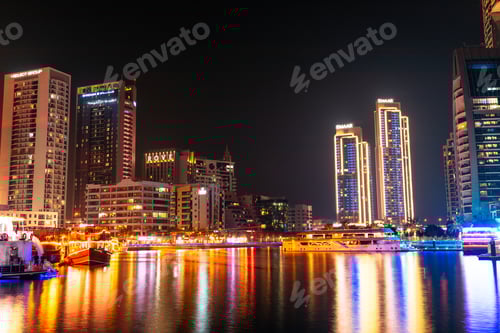 Preview: Dubai Marina canal with boats in Dubai at night