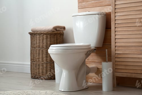 Preview: Toilet bowl near wooden wall in modern bathroom interior
