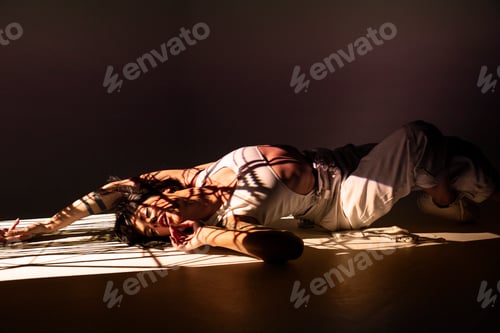 Preview: Woman dancing under bright light